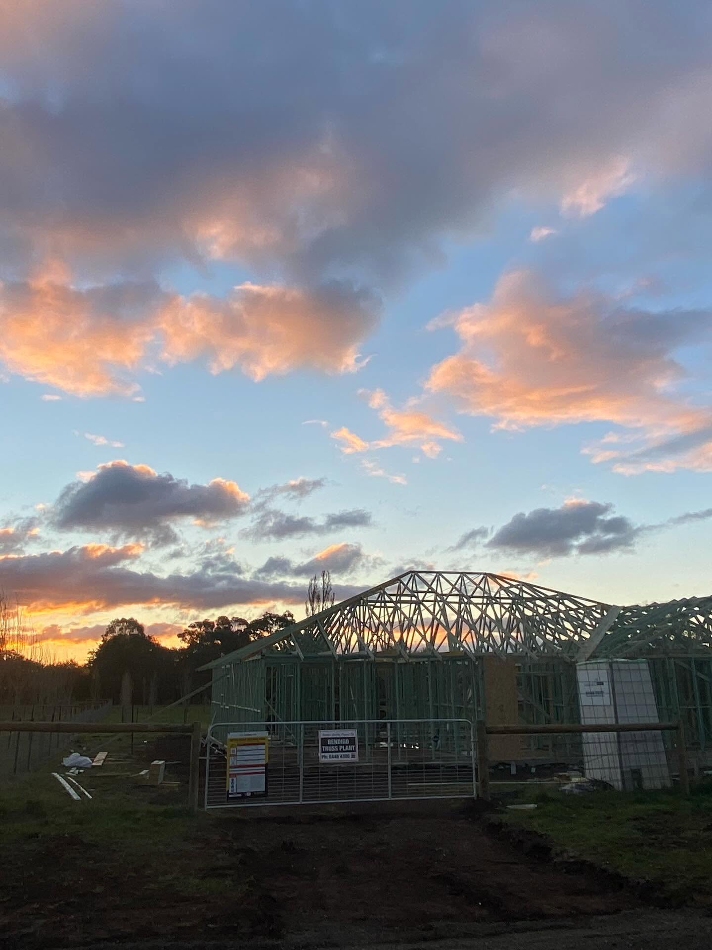 House frame under a dramatic sunset sky — Andrew's Timeless Carpentry project in Victoria