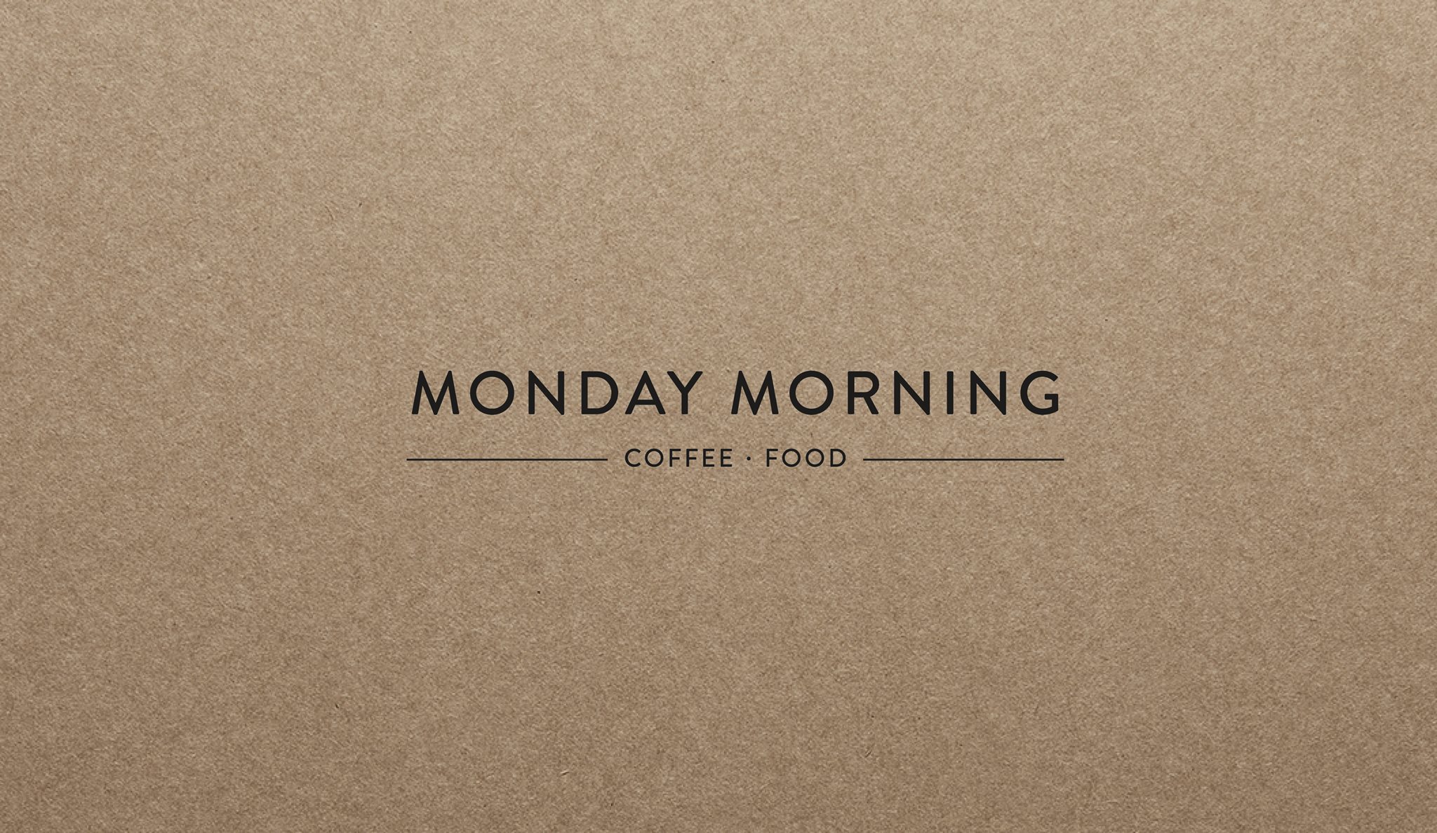 Monday Morning Cafe logo on kraft cardboard texture representing quality coffee and food