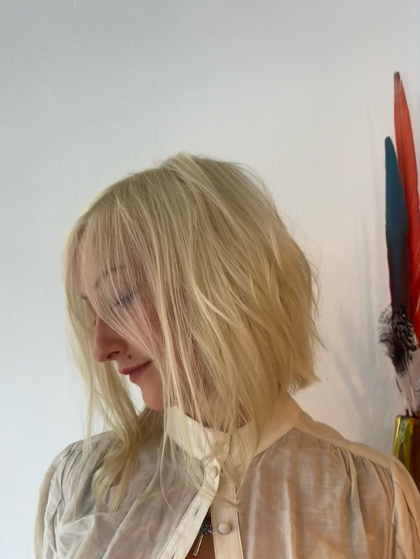 Short blonde textured bob with a soft fringe