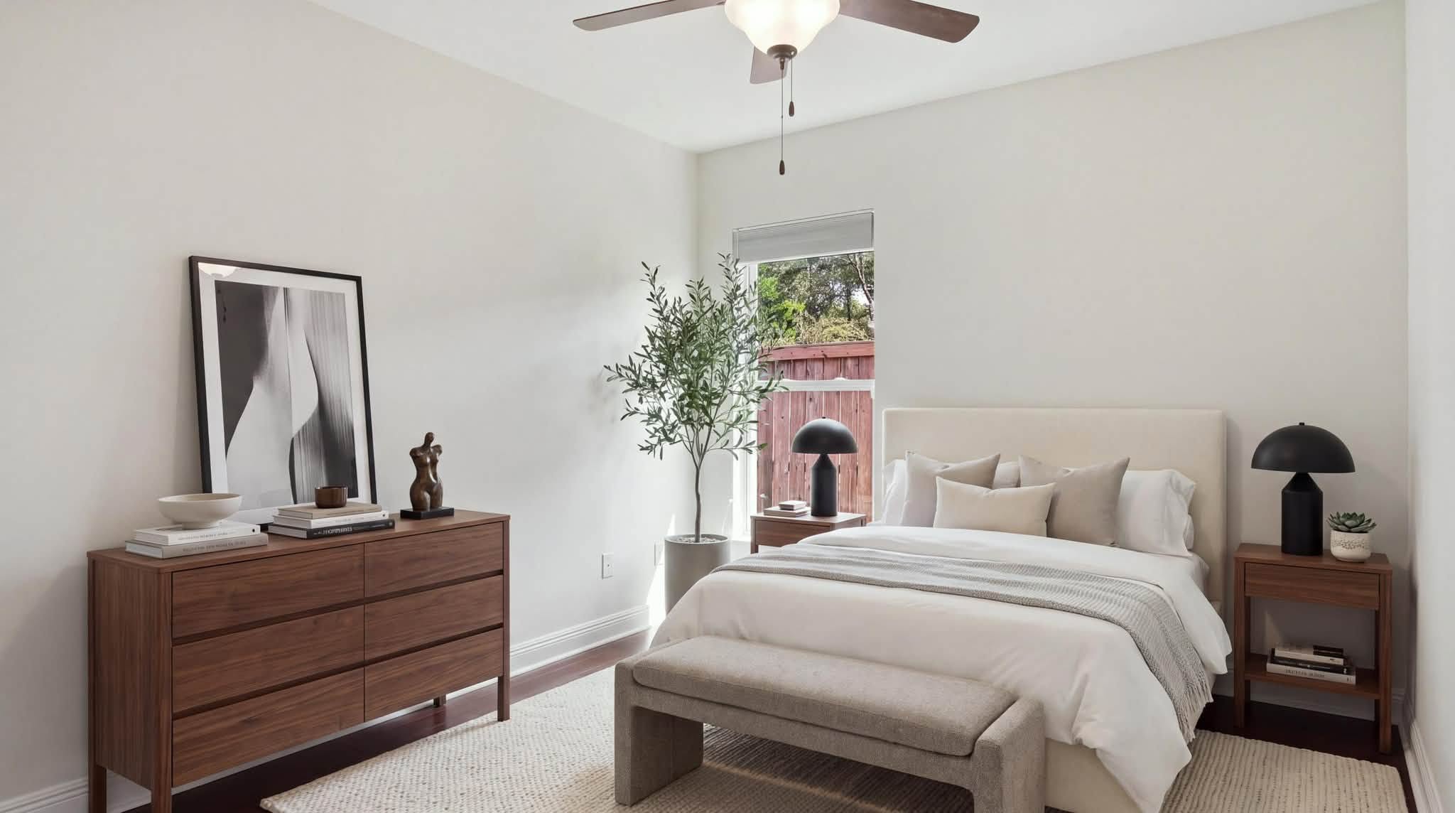 A well-presented bedroom with wooden furniture, representative of the homes managed by our agency