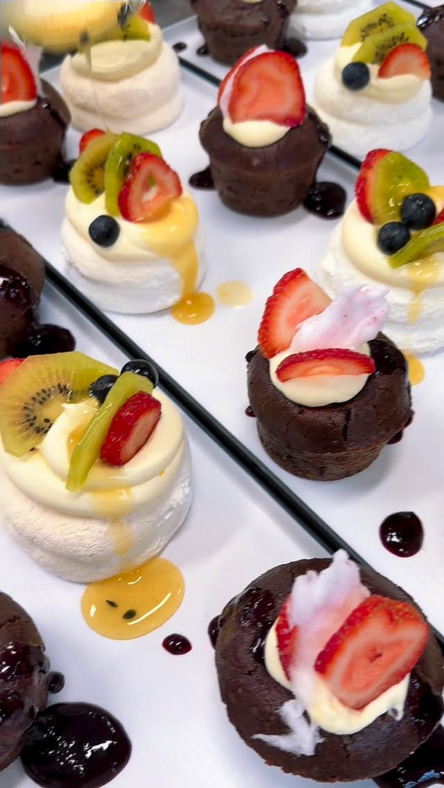 Assorted dessert canapes — mini pavlovas and chocolate bites for events