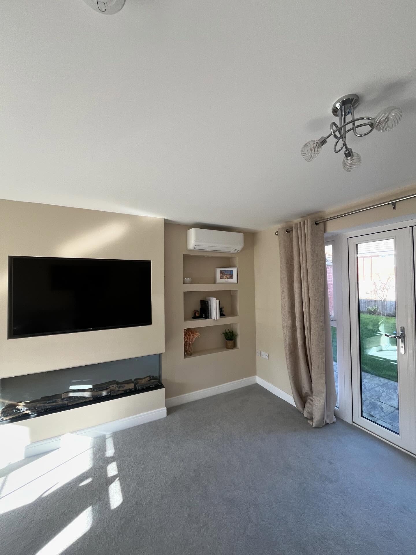 Professionally installed wall-mounted split system air conditioner in a modern living room