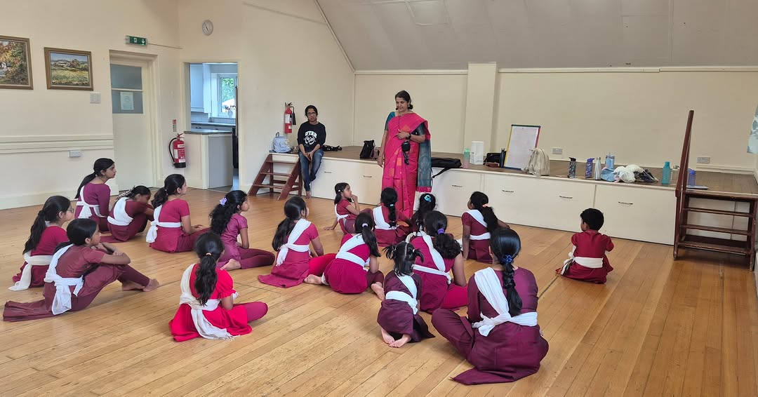 Dance teacher practising Bharatanatyam hand mudras during an online class at home