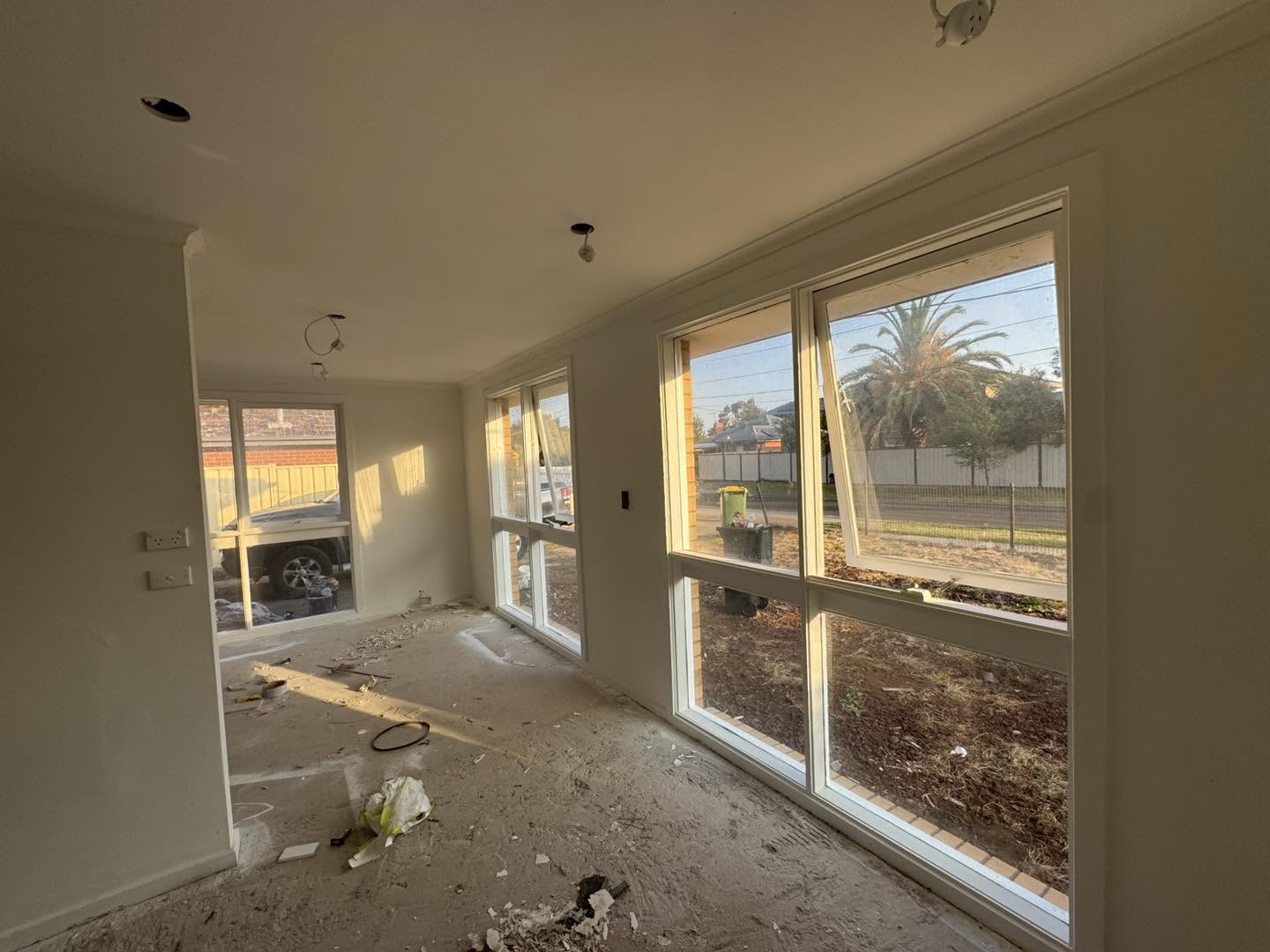 Spacious room with freshly prepared and painted plaster walls