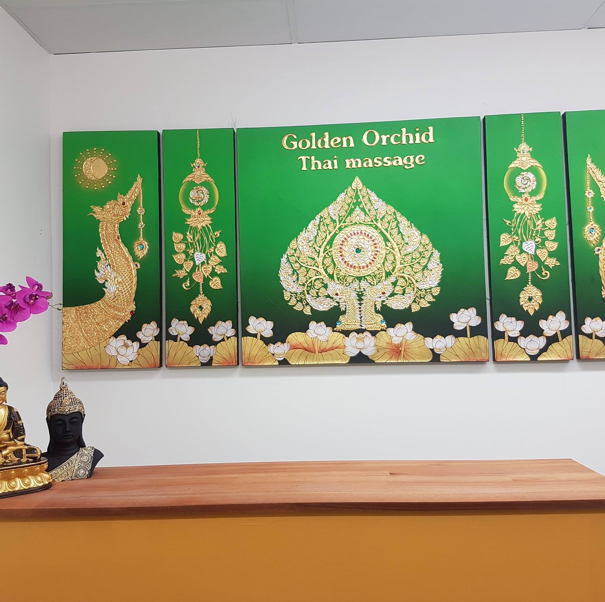 Golden Orchid Thai Massage reception area with Thai artworks and welcome counter