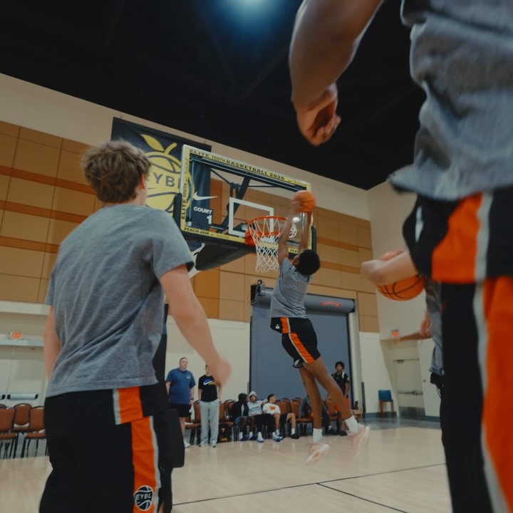Young basketball players training in an indoor court