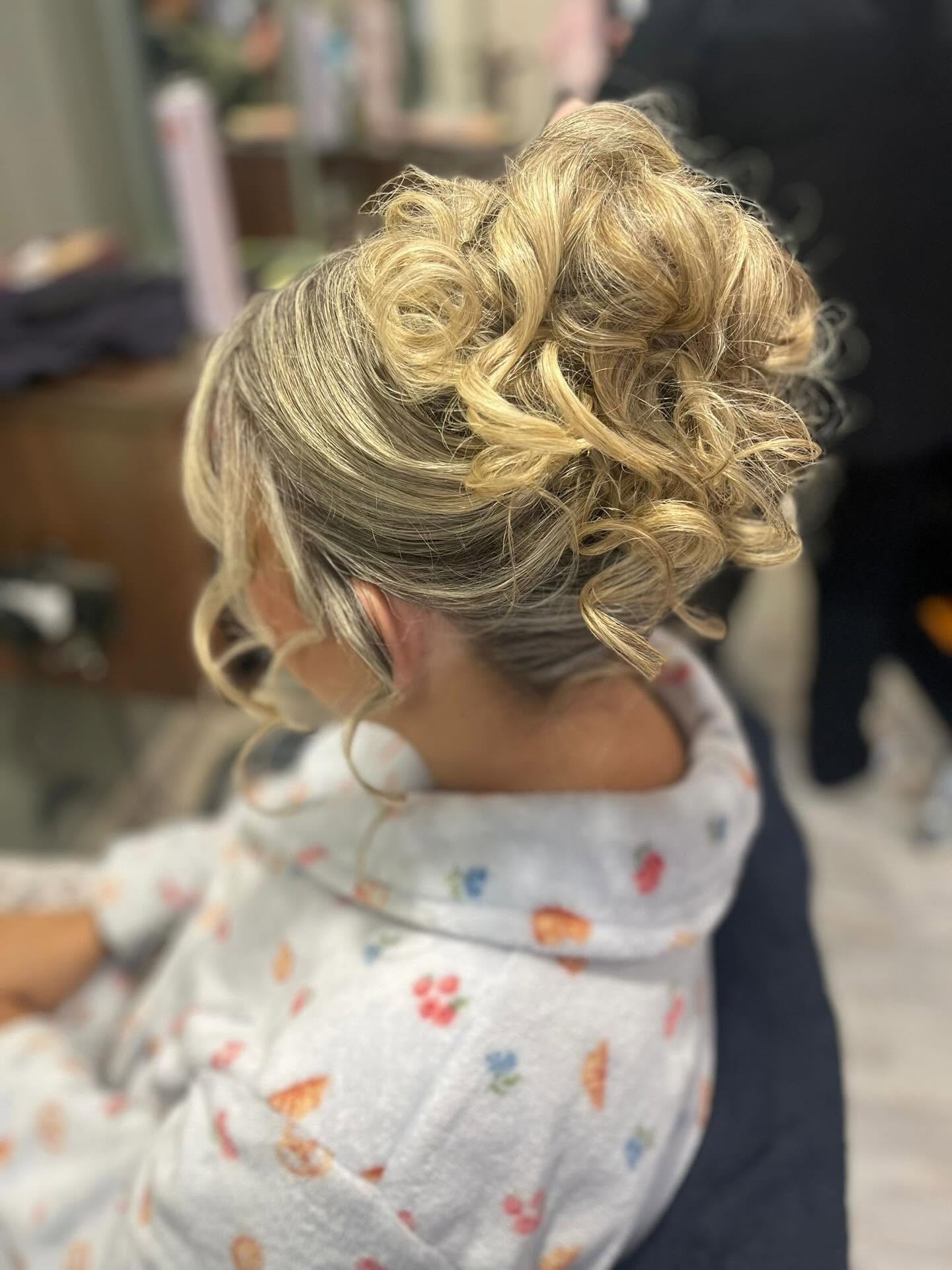 Blonde curly updo styling