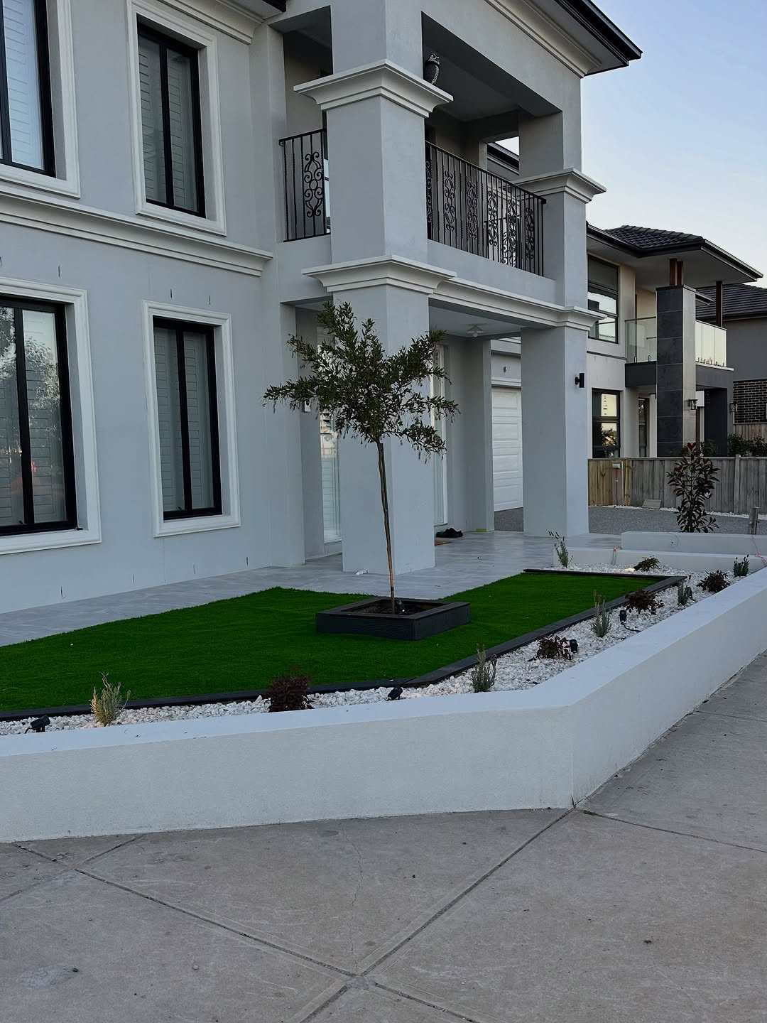 Luxury residential property with front garden and boundary fencing assessment