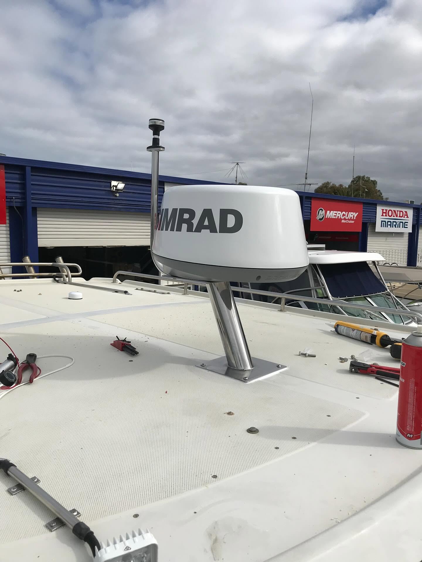 Custom stainless steel radar mast pole with Simrad dome fitted to a vessel roof