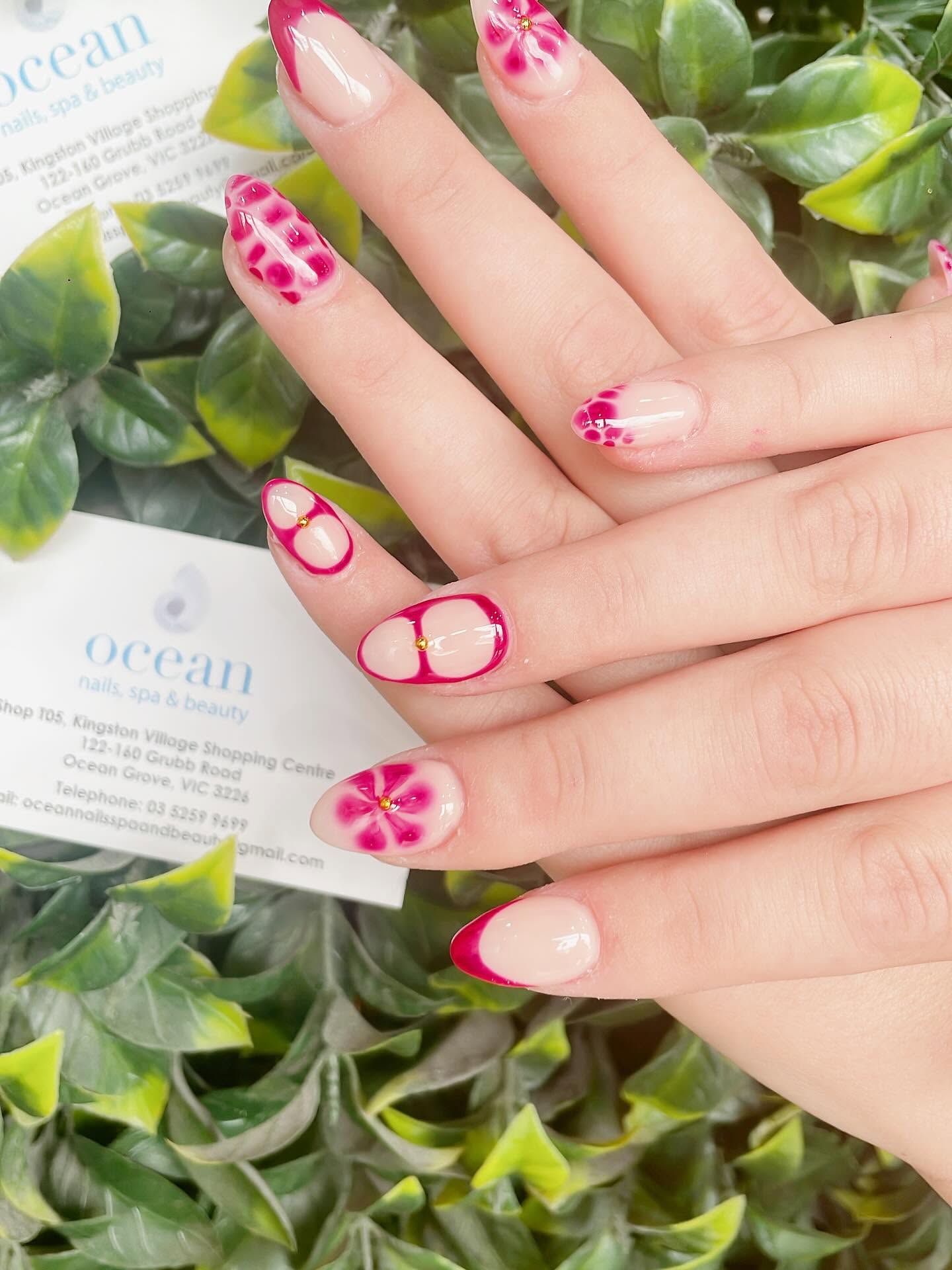Hot pink and magenta floral nail art with business card