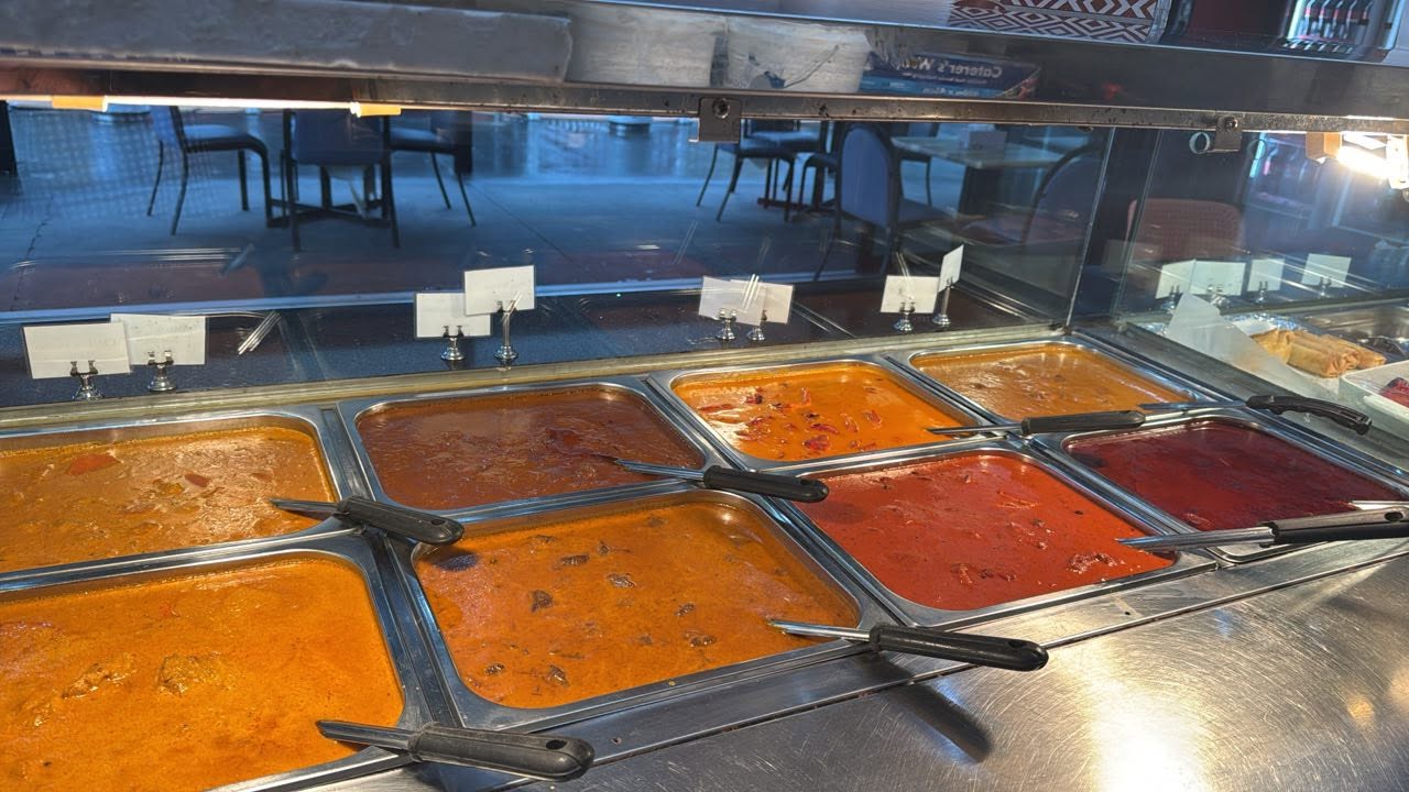 A display of fresh Indian curries in a bain-marie at Nargis Indian & Kebab