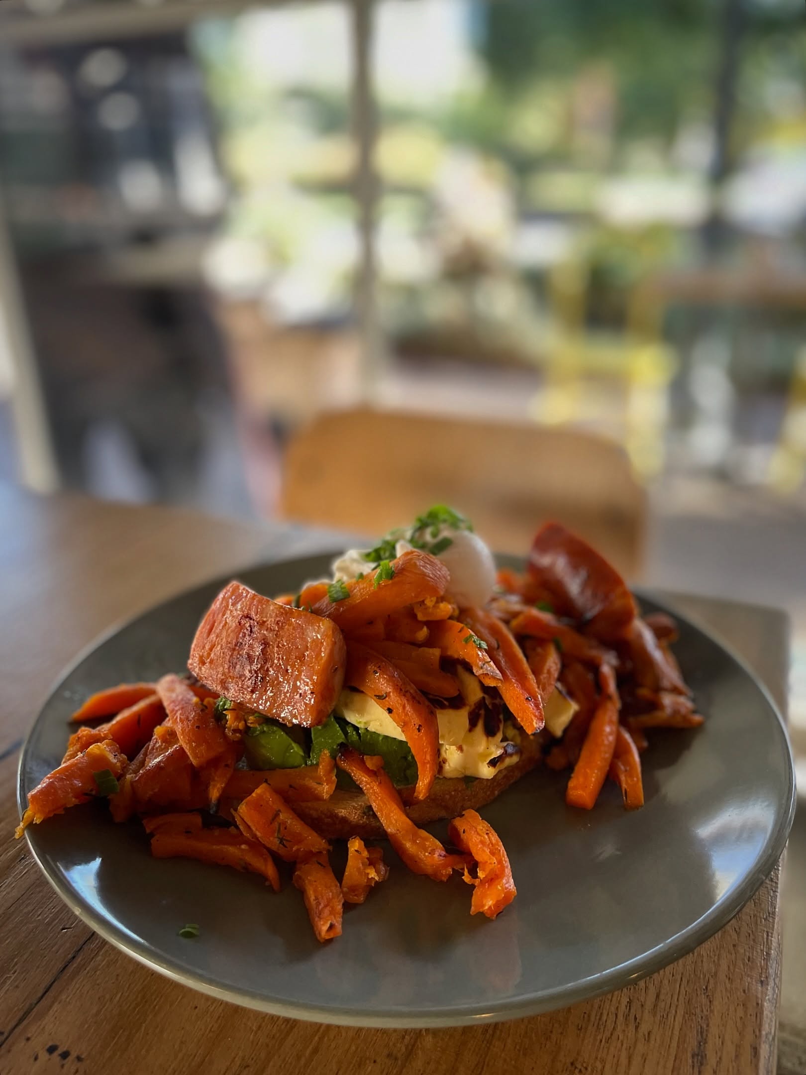 Sourdough toast topped with avocado, feta and roasted sweet potato