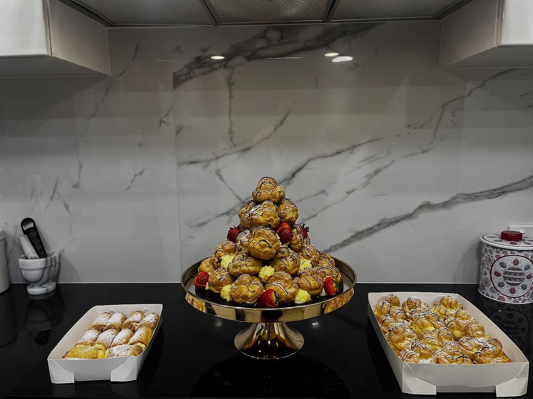 Casa Del Cannoli branded roll-up banner at a market event showing the full range of Italian sweets