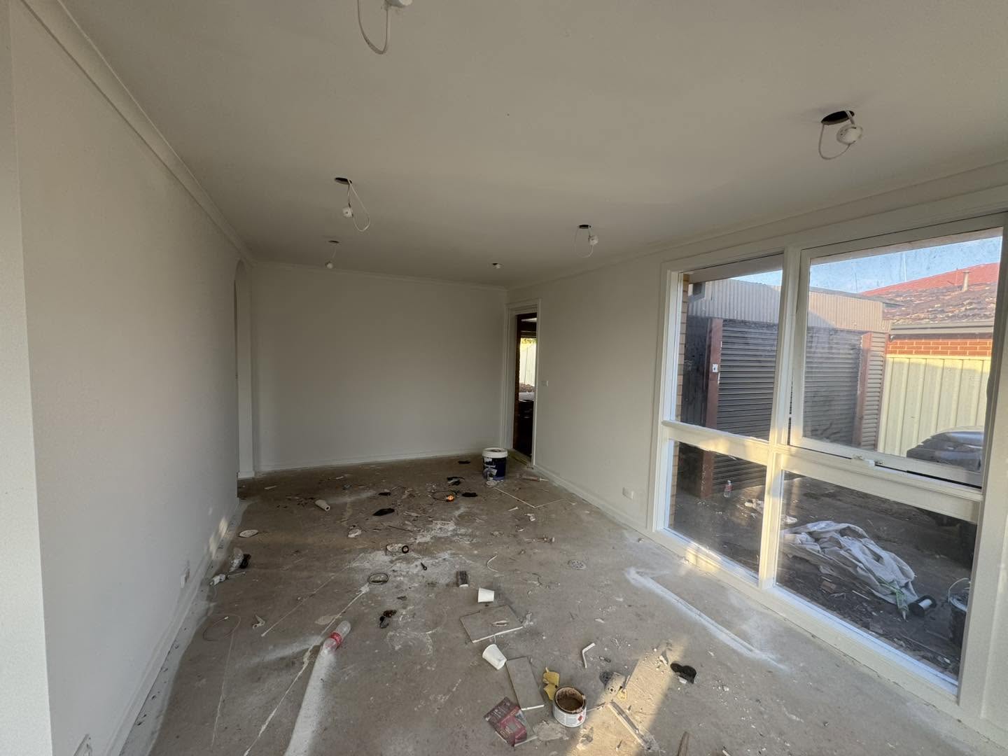 Completed interior painting — smooth white walls ready for handover