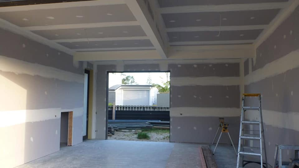 Interior room showing plasterboard installed on walls and ceiling during a building alteration project