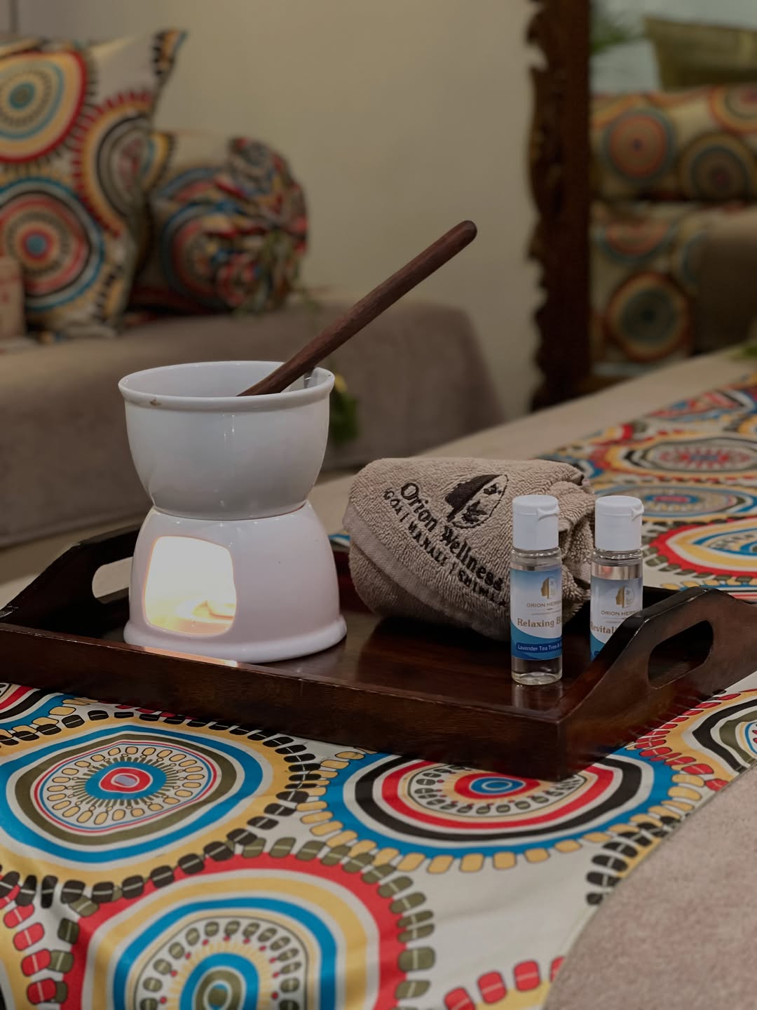 Aromatherapy diffuser and essential oils set on a massage table — couples massage preparation