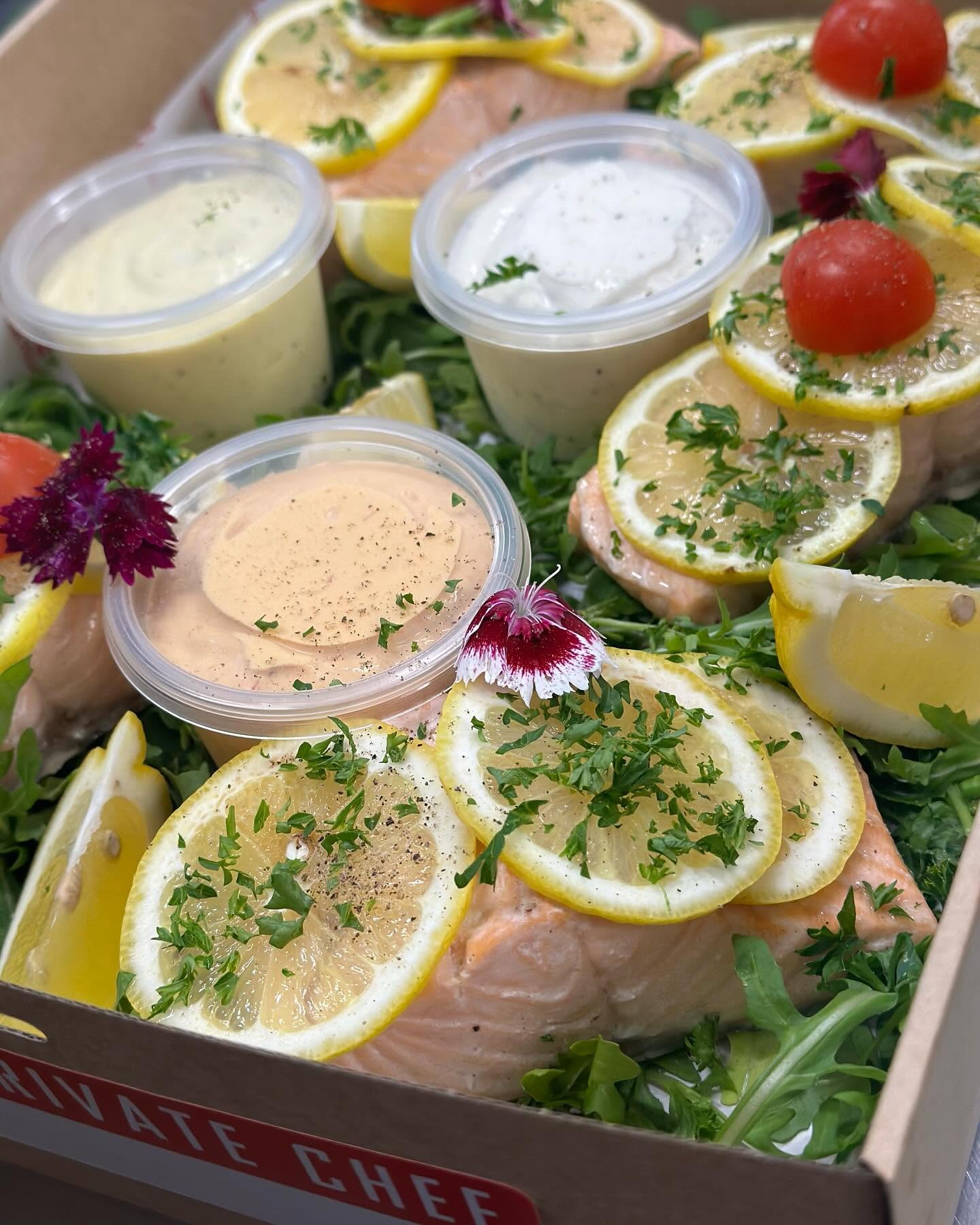 Elegant salmon platter with lemon and rocket for a private event