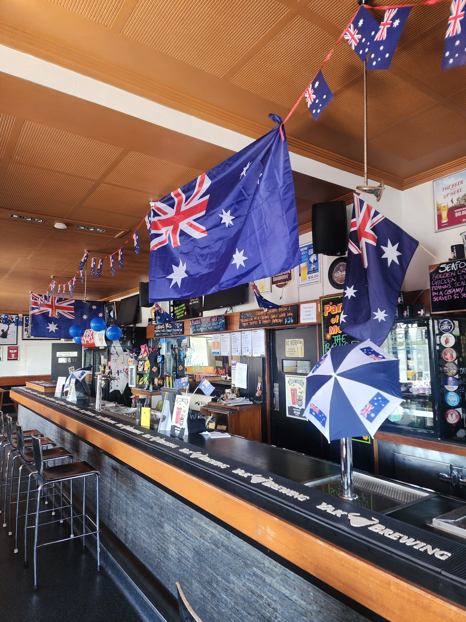 The Yardz Hotel bar interior decorated with Australian flags