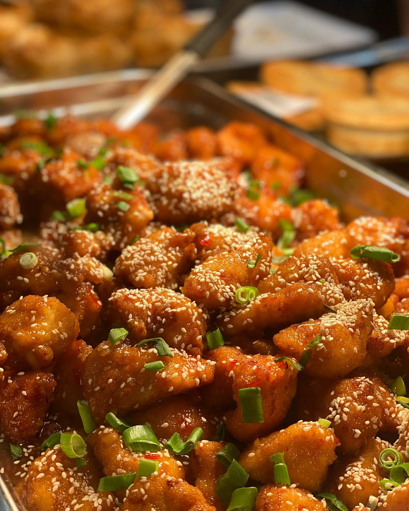 Crispy fried pieces with sesame seeds and spring onion