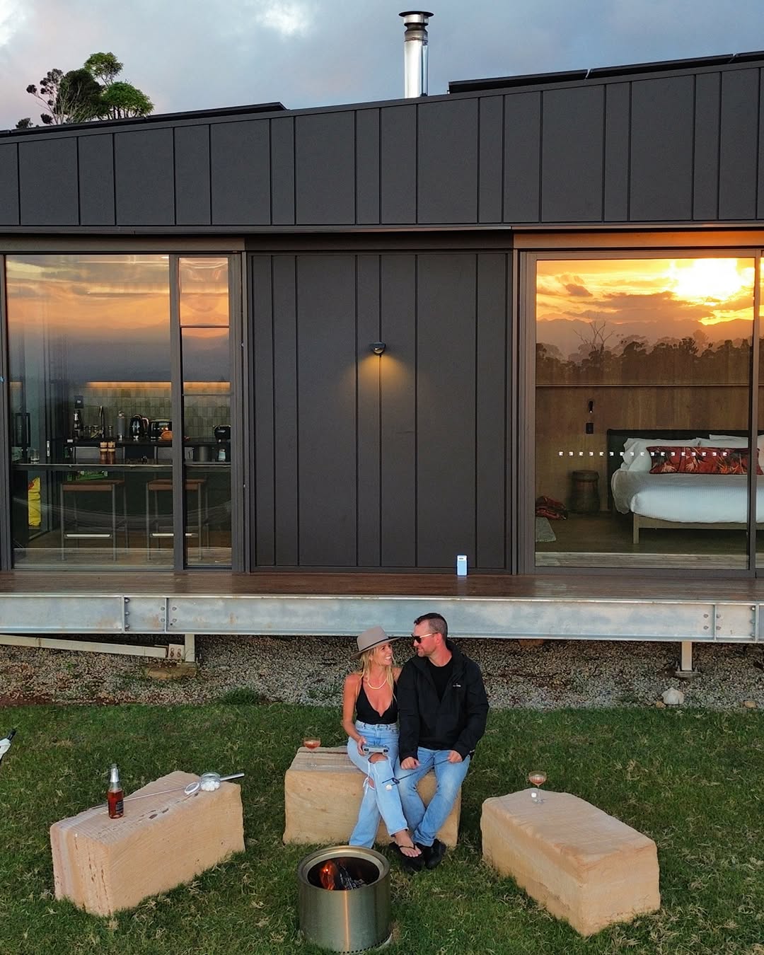 Modern eco glamping cabin with firepit at dusk, Scenic Rim Queensland
