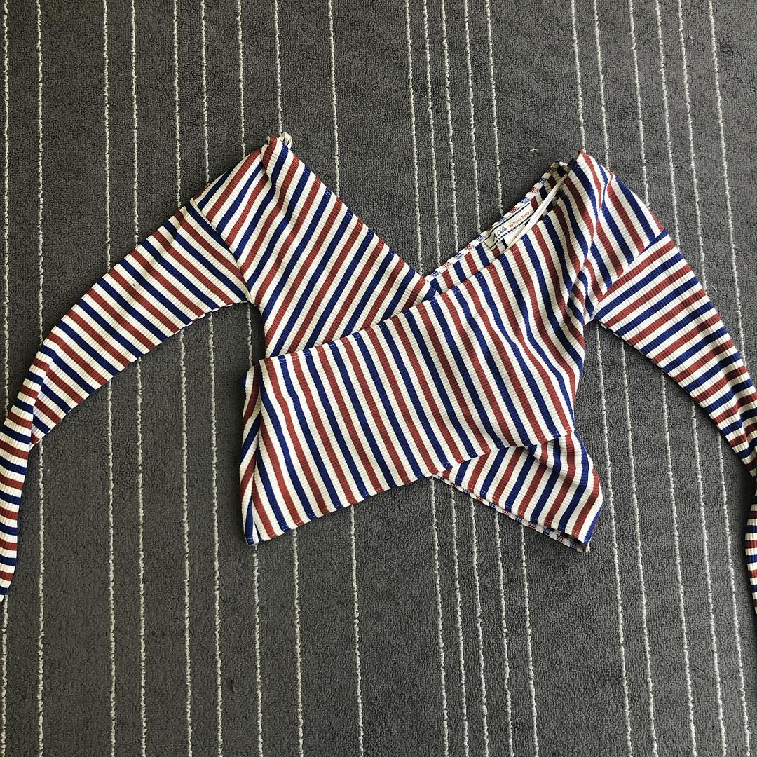 Striped long-sleeve wrap top laid flat