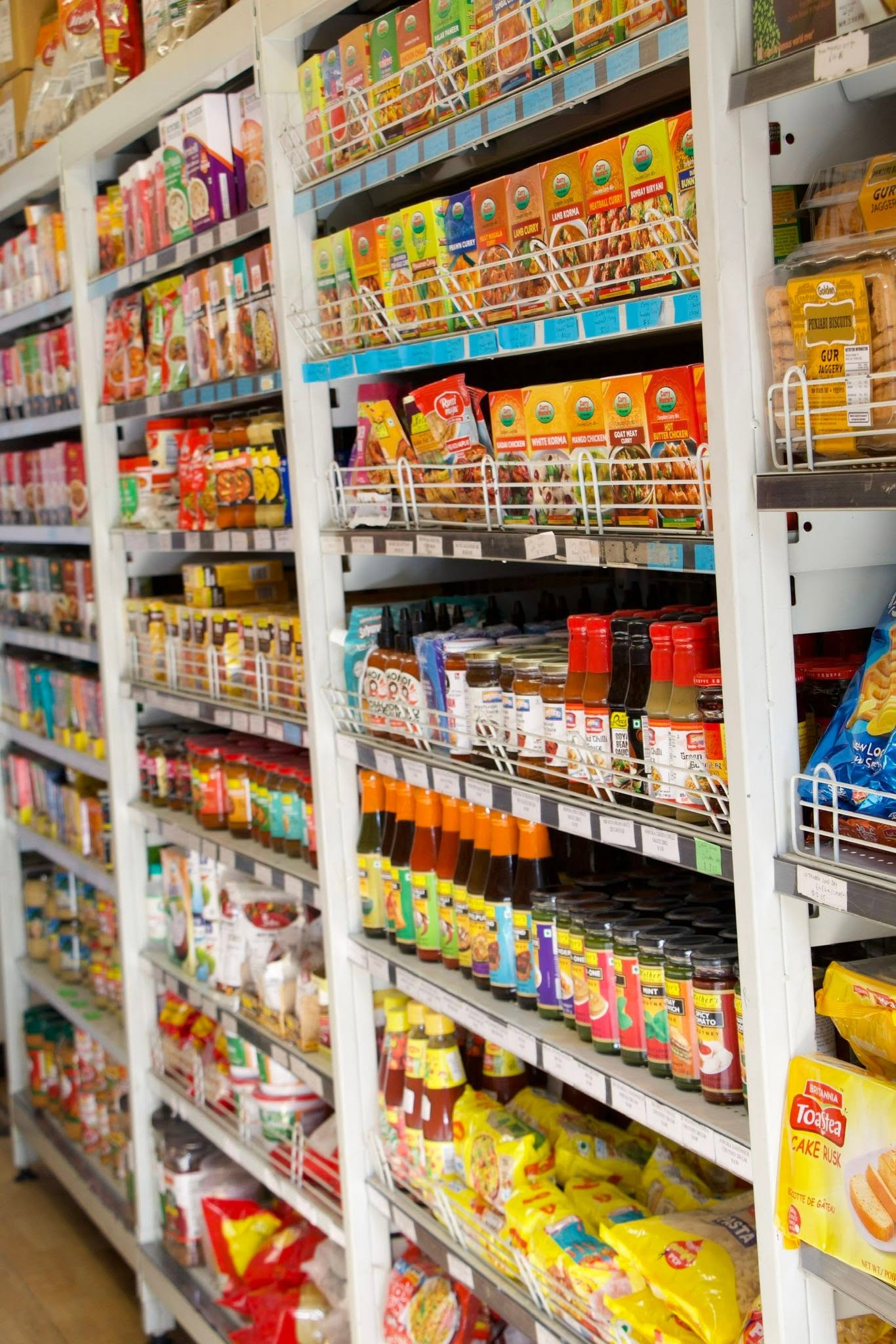 Shelves of Indian and South Asian grocery sauces, pickles and cooking ingredients