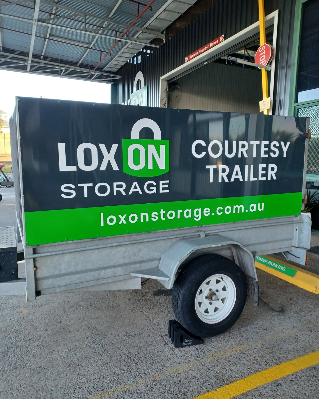 Loxon Storage courtesy trailer parked at the facility — ideal for moving and vehicle storage customers