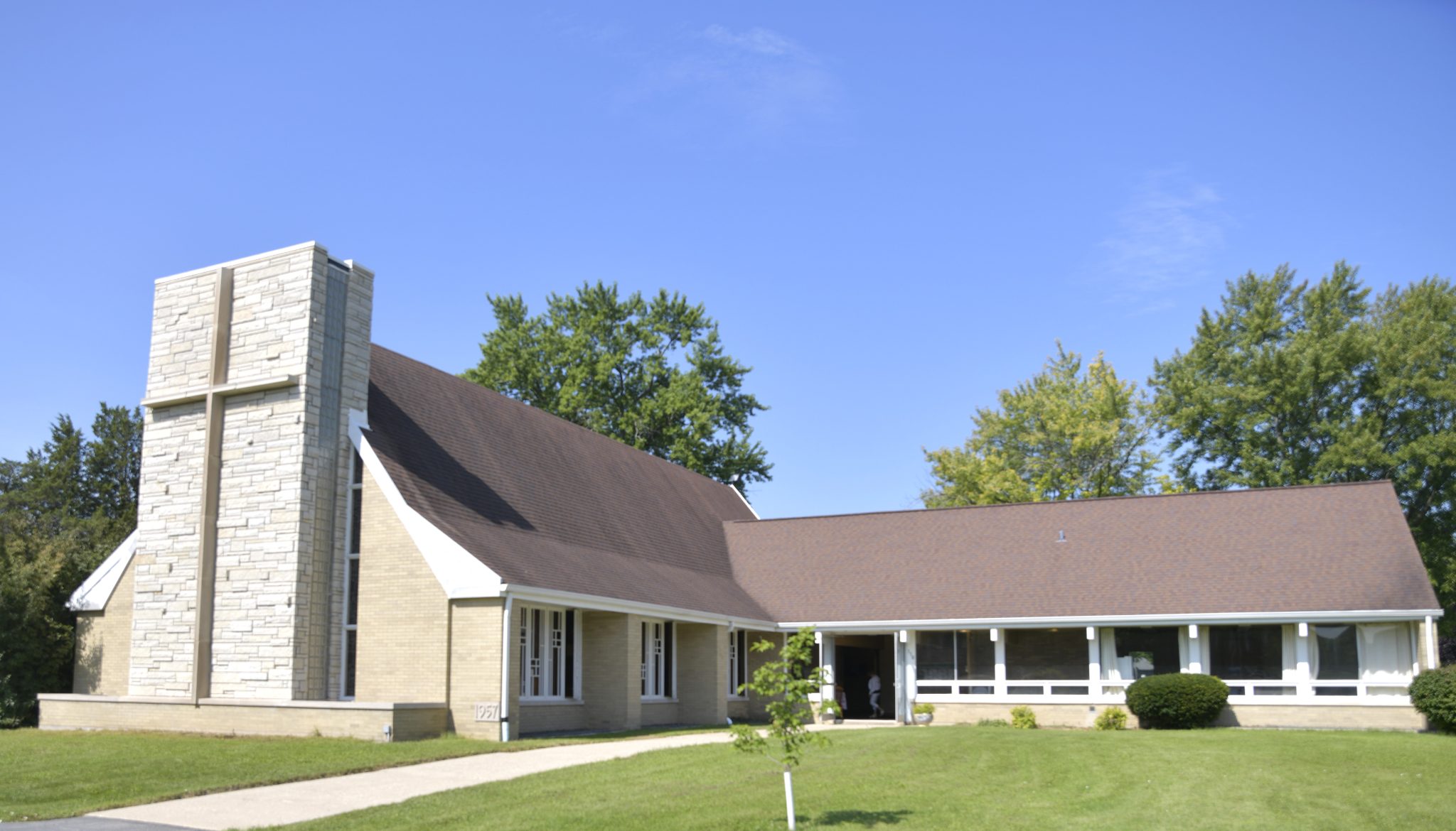 Lake Villa United Methodist Church exterior with stone cross tower