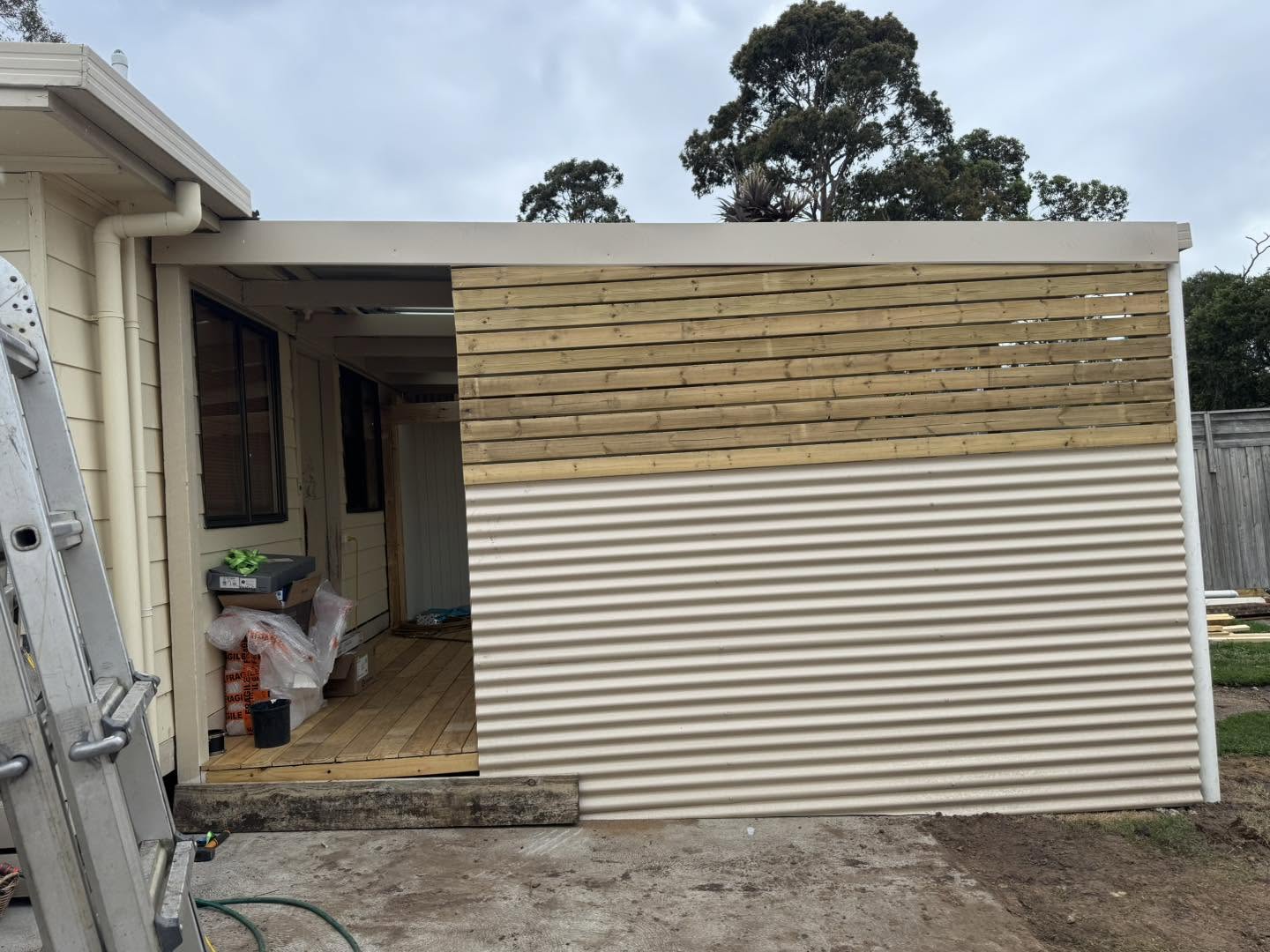 Timber slat and corrugated cladding carpentry finish