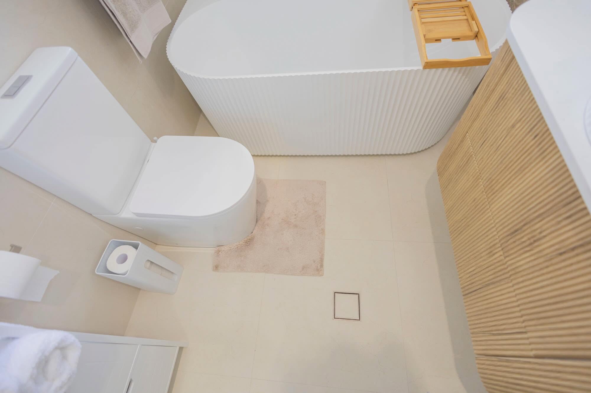 Overhead view of beautifully laid floor tiles in a renovated bathroom – Wollondilly Tiles