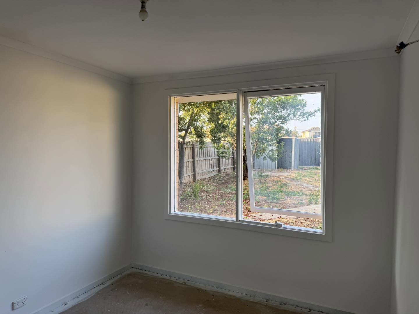 Clean freshly painted white interior room with natural light