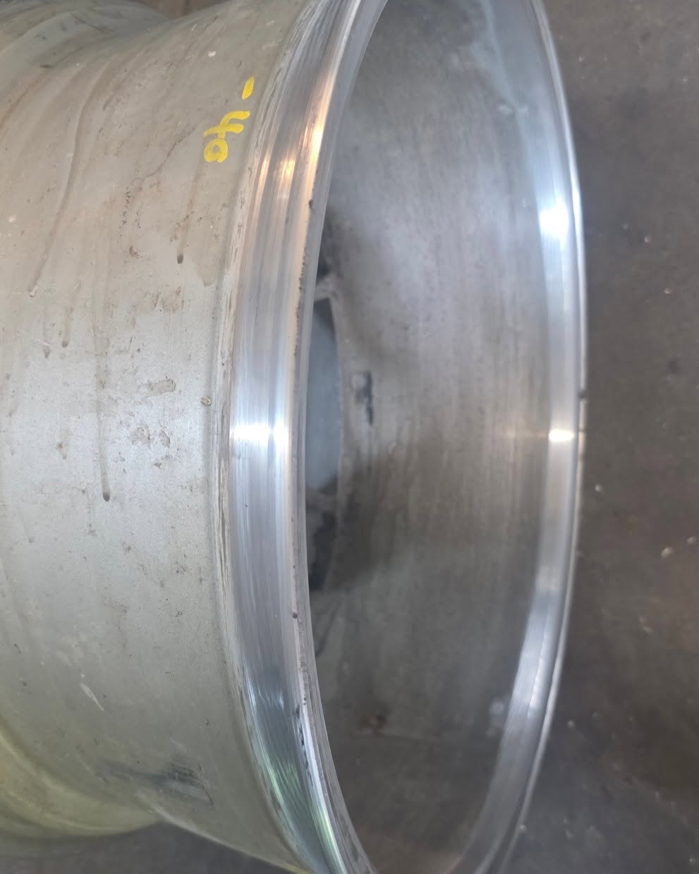 Heavily weathered alloy wheel barrel before restoration process