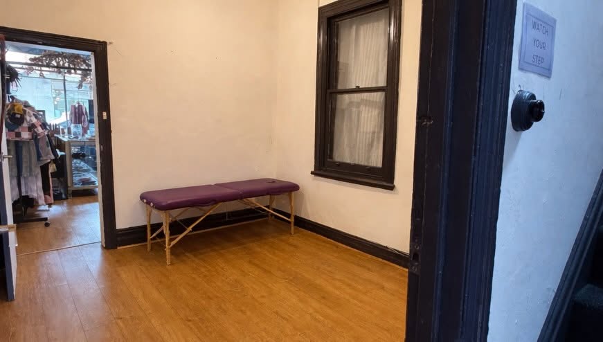Epping Natural Therapies Centre treatment room with massage table and warm timber floors