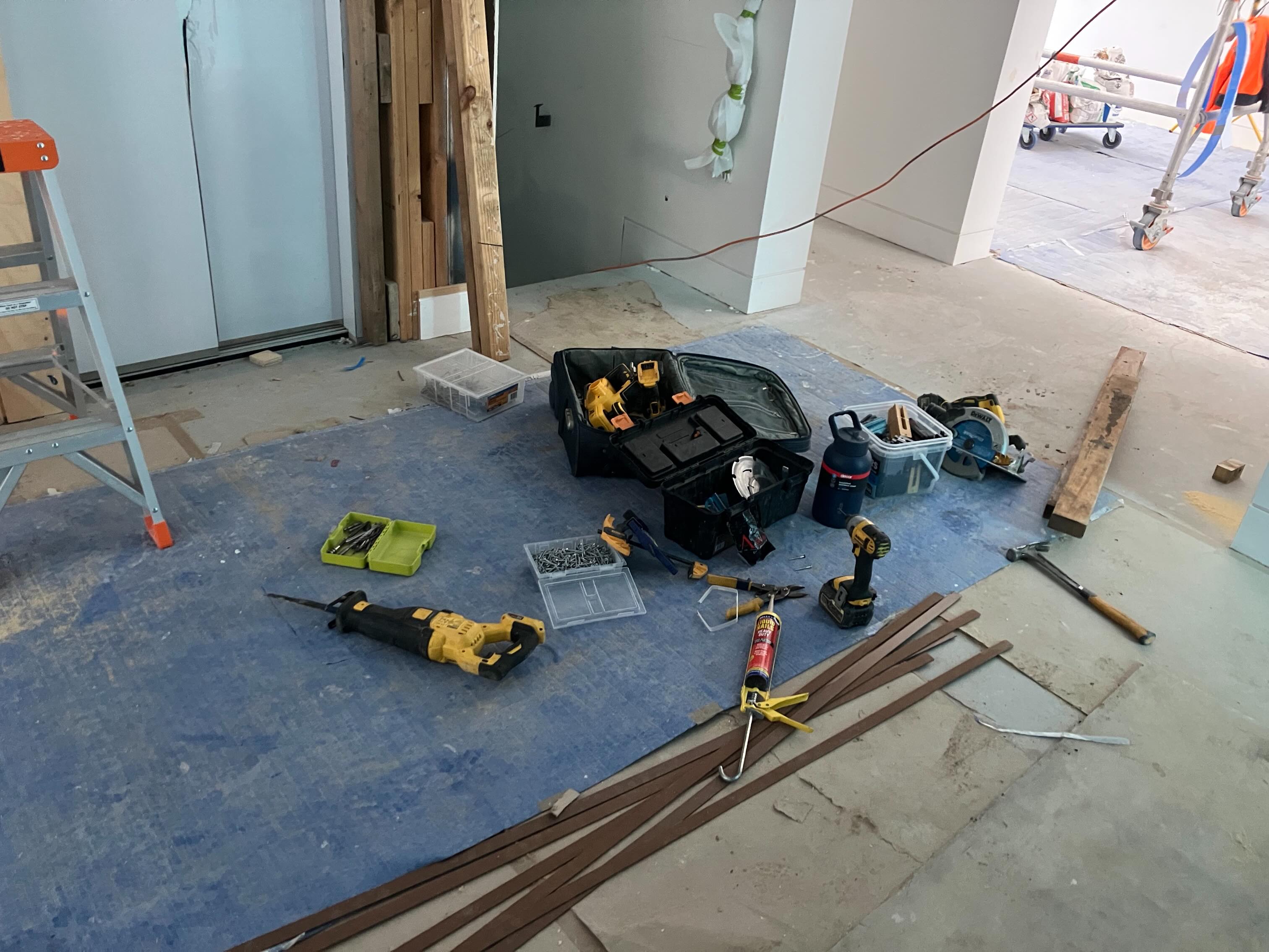 Building tools and equipment laid out on-site during construction