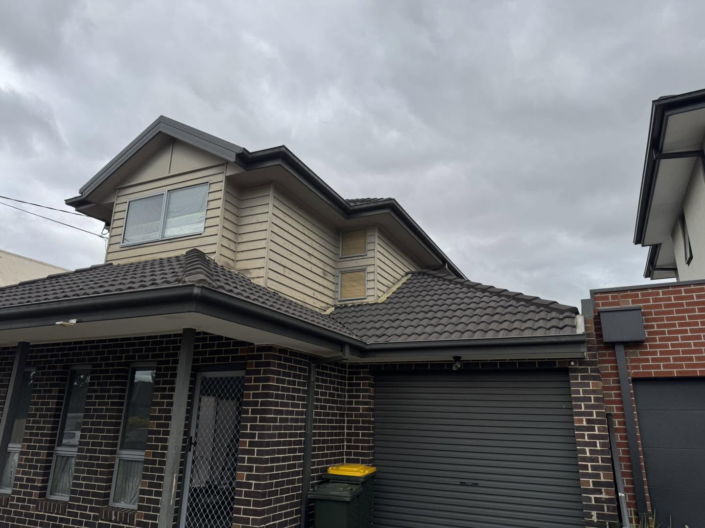 Exterior house prior to painting — weatherboard surface preparation