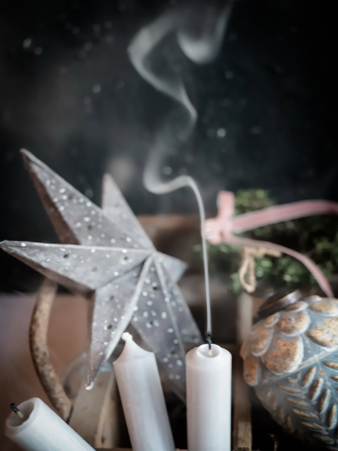 Candles and star ornament — atmospheric still life