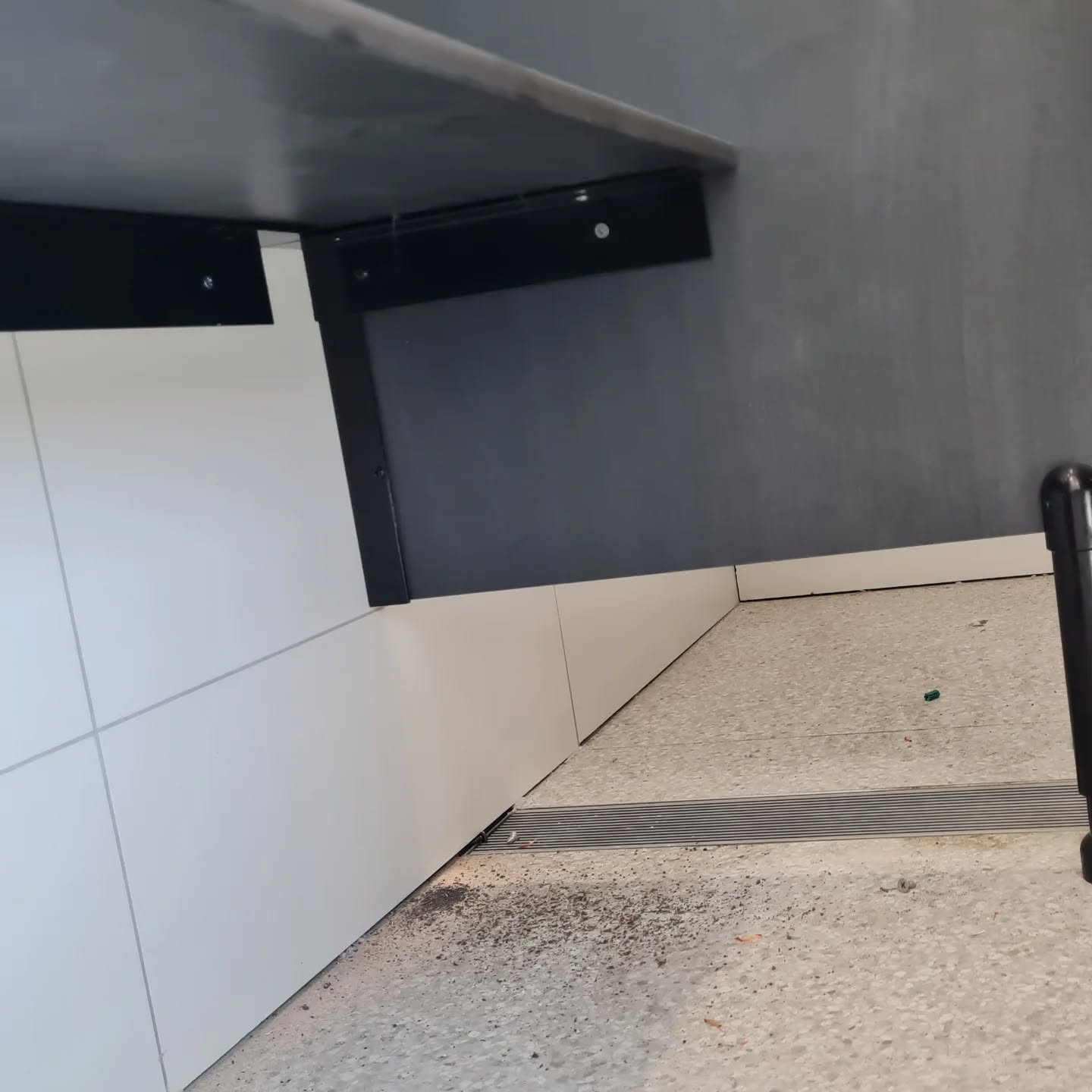 Commercial tiling and drainage channel detail — general building construction work