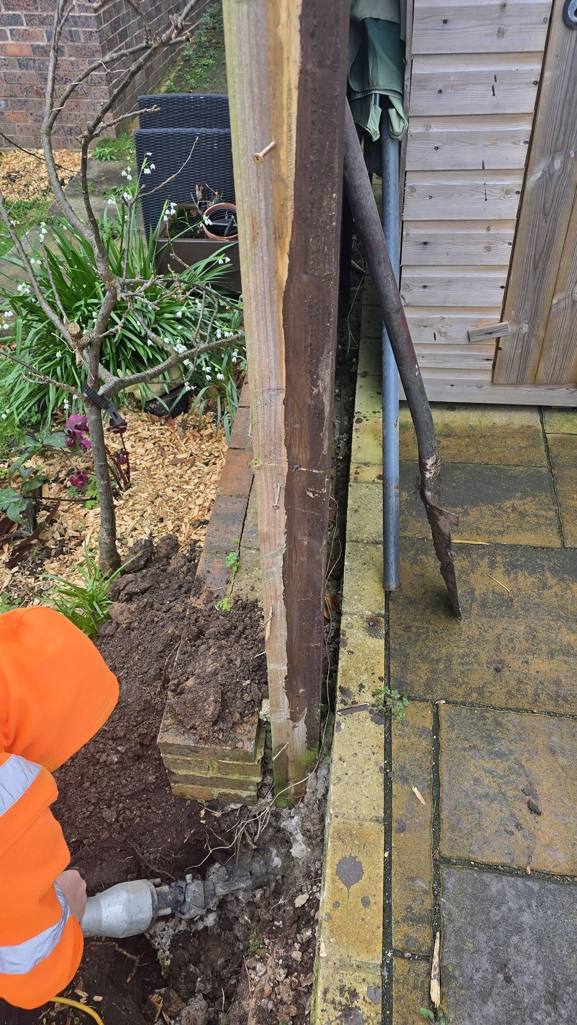 Stone paving beside a garden bed with planted pots — Branching Out paving work in Melbourne