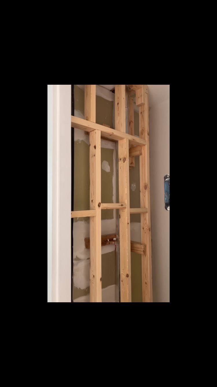 Close-up of timber door and wall framing during a home build