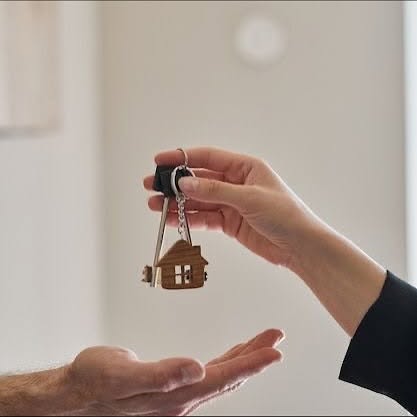Property keys being handed over, representing financial planning for property and assets