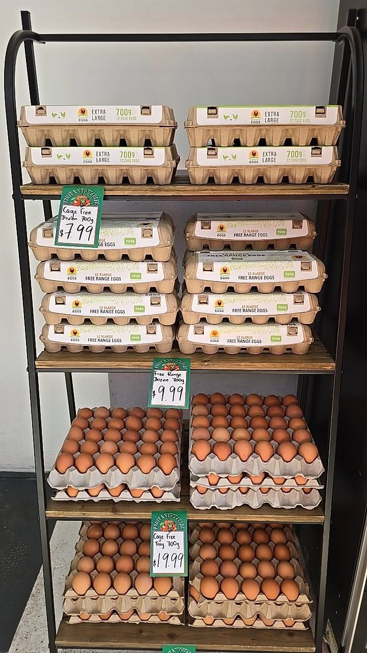 Cartons and trays of eggs on a display shelf at Fawkner Fresh