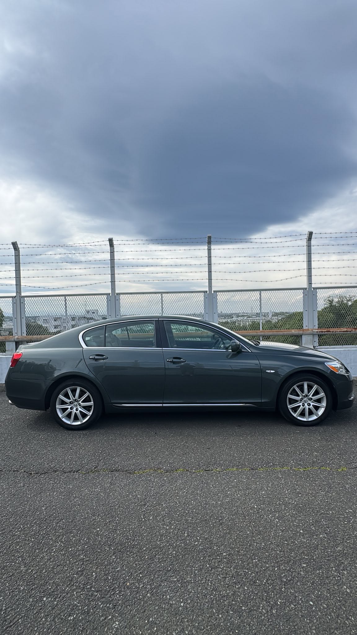 Dark green Lexus GS sedan — side profile view