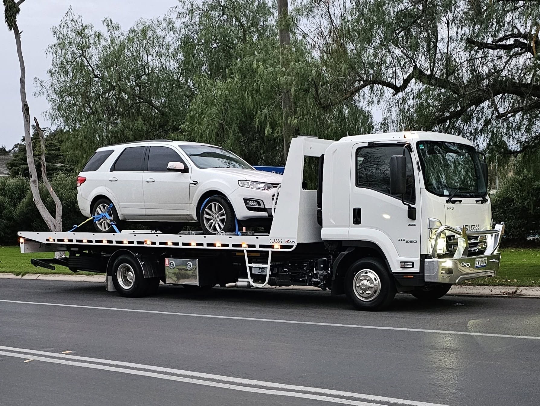 Flat-bed tow truck assisting a vehicle in the Casterton area