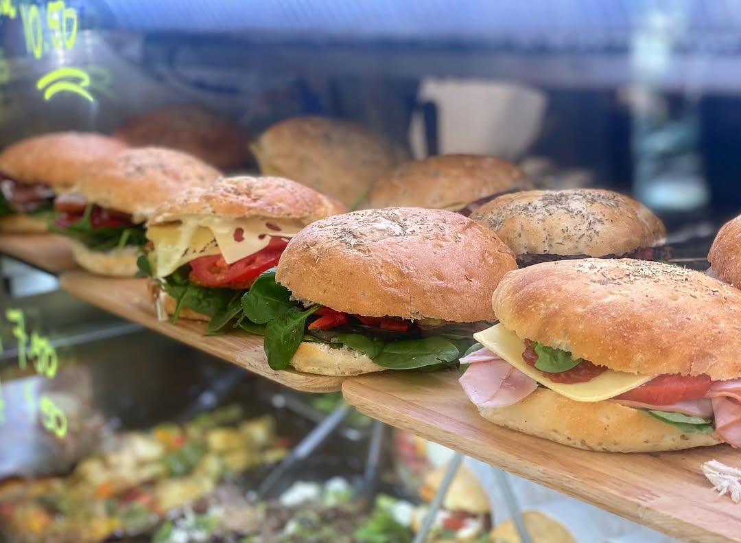 Freshly made gourmet focaccia rolls displayed at Jorge's Cafe