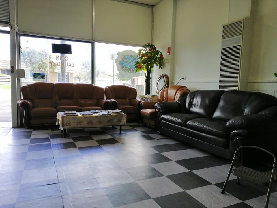 Comfortable waiting area with couches inside Chandler Coin Laundry