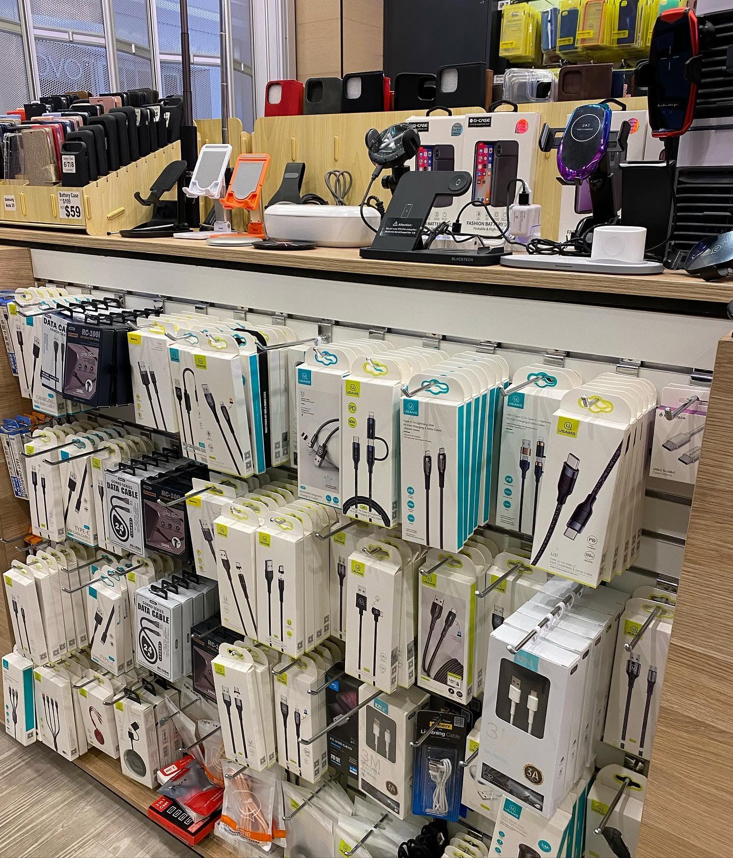 Pimp My Mobile store interior showing full shelves of accessories and Repair Station counter