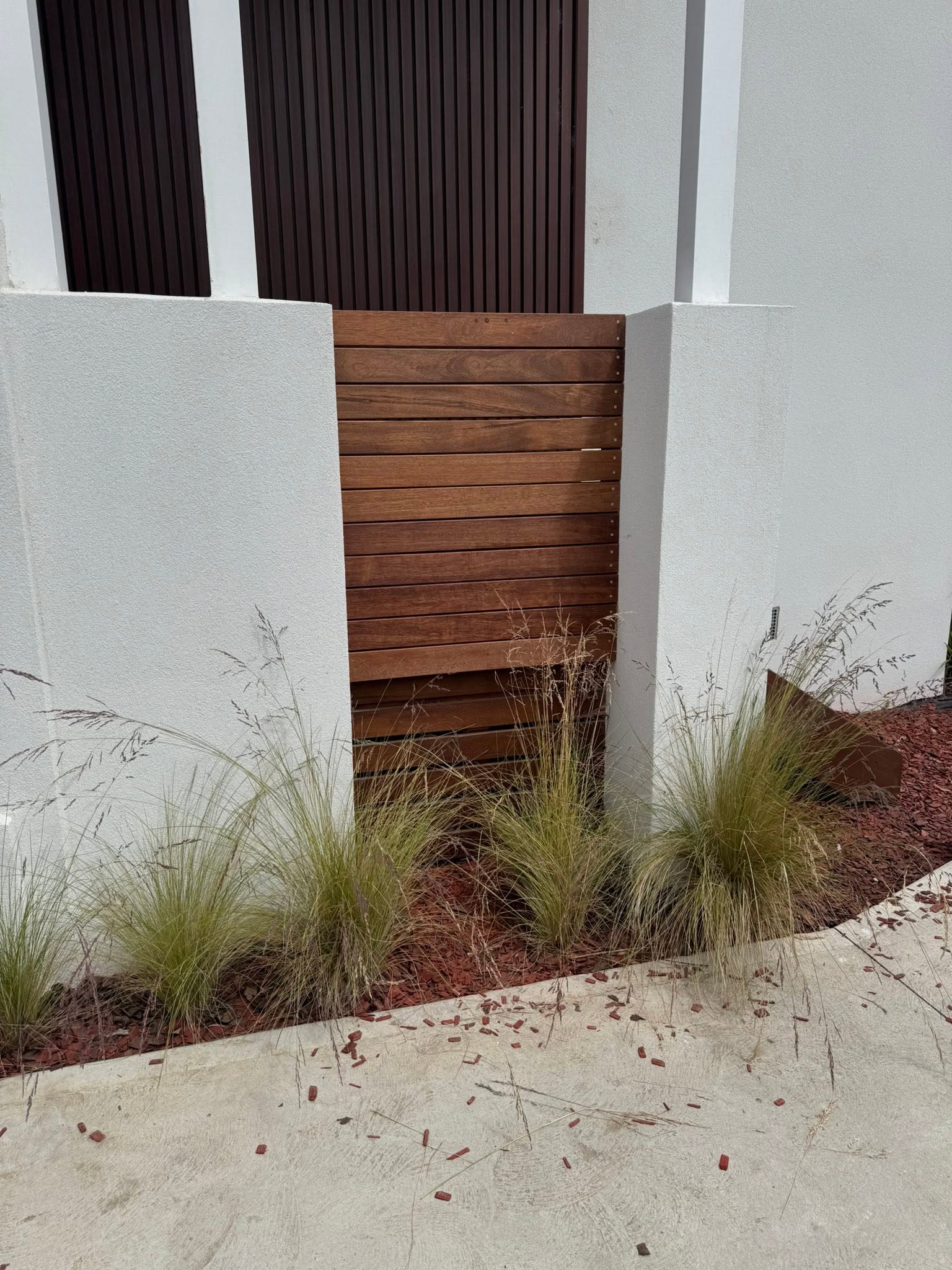 Close-up of stained timber slat gate carpentry