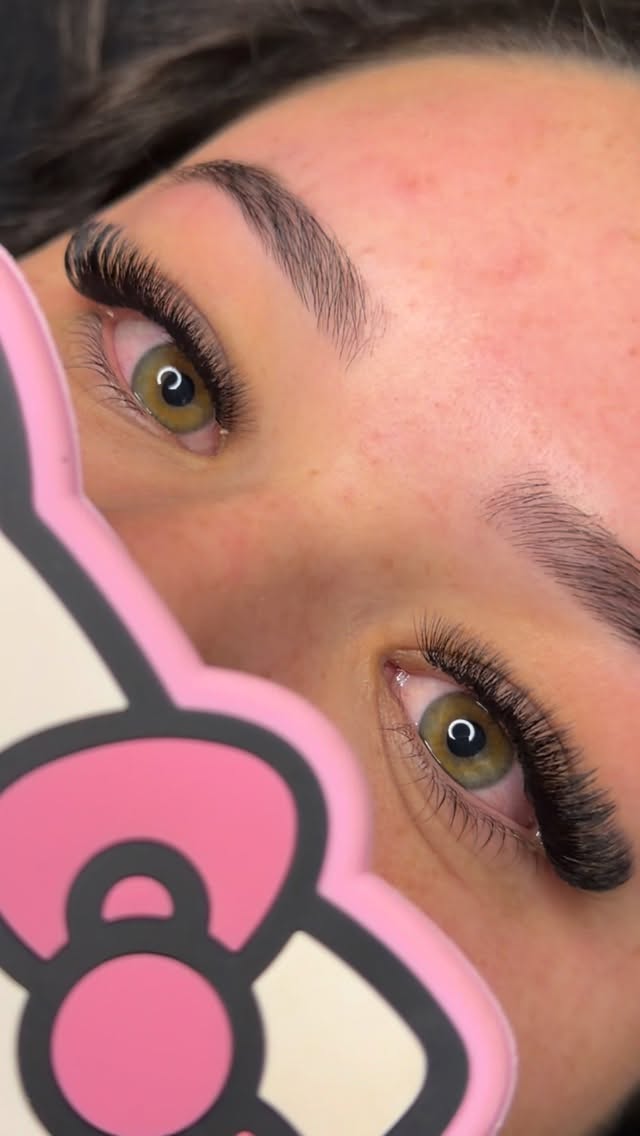 Close-up of hazel eyes with beautifully maintained lash extensions