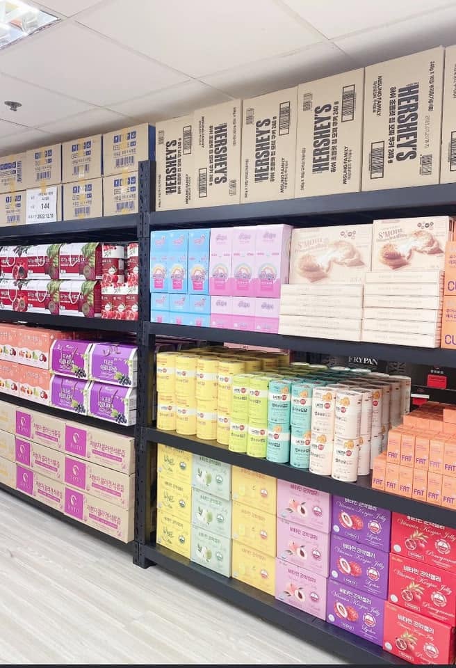 Shelves stocked with Korean snacks and grocery items at JNS Korea