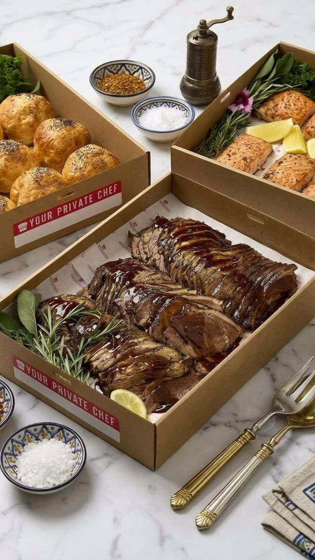 Your Private Chef branded BBQ boxes with roast meats and fresh bread